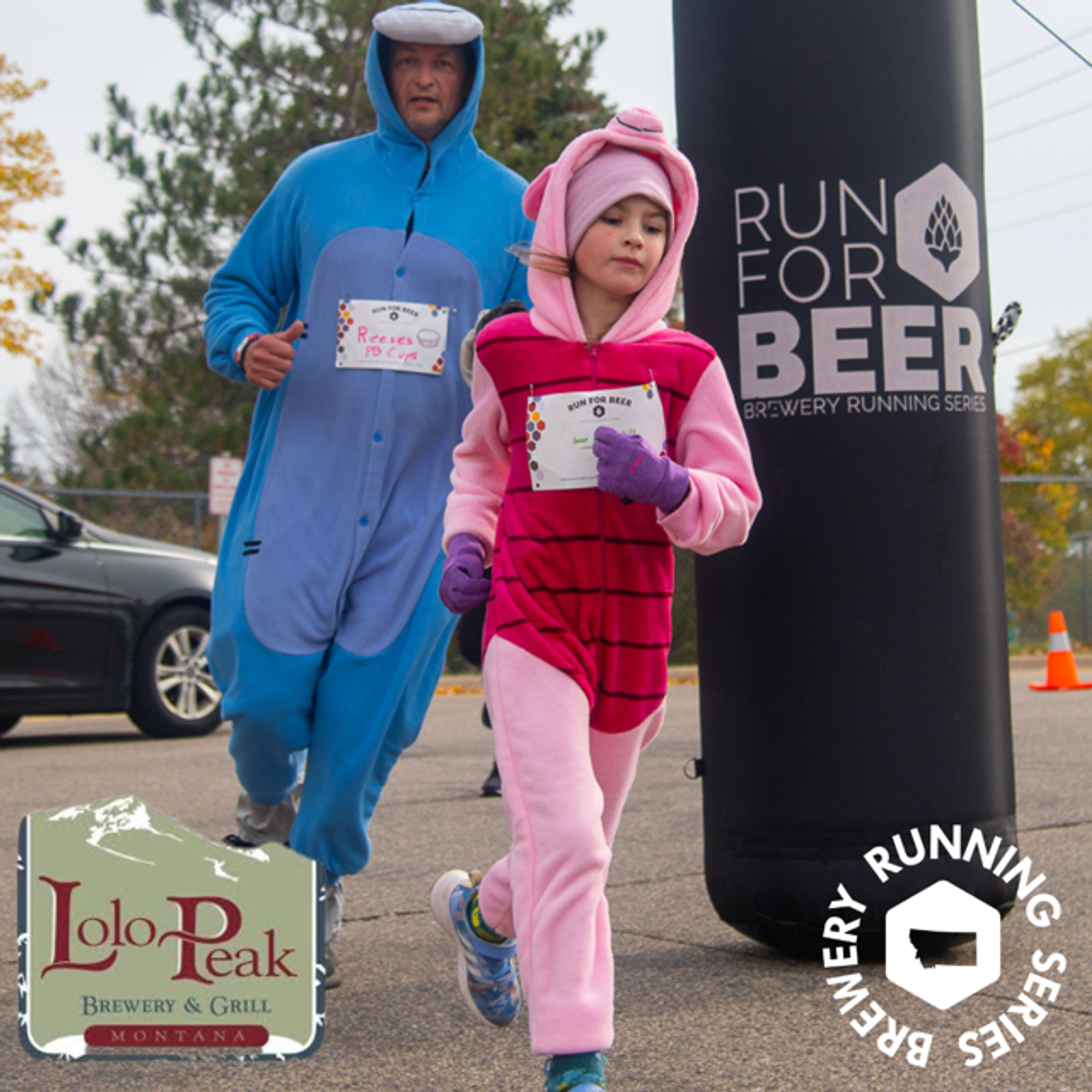 An adult and a child dressed in animal onesies run past a black "Run for Beer" event marker. The child wears pink stripes, the adult wears blue. Lolo Peak Brewery & Grill and event logos are visible.