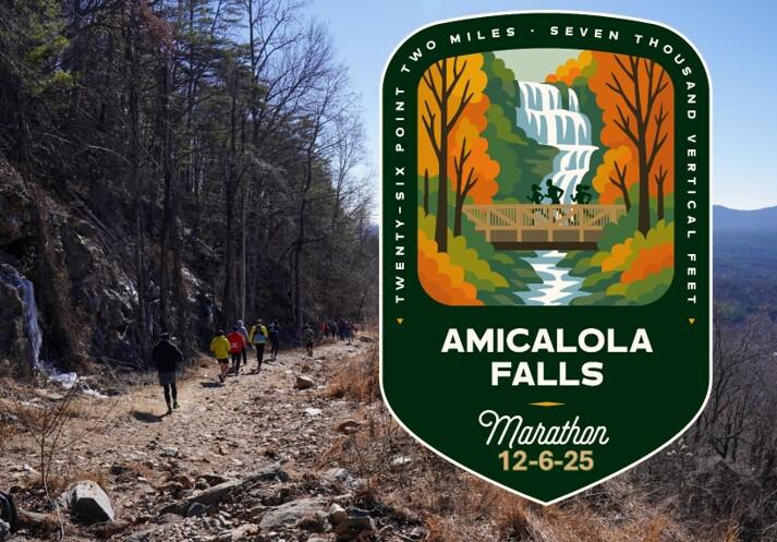 A group of hikers ascends a rocky, wooded trail beside a cliff. An illustrated badge features Amicalola Falls, a bridge, autumn trees, and marathon details: "Amicalola Falls Marathon 12-6-25, 26.2 miles, 7000 vertical feet.
