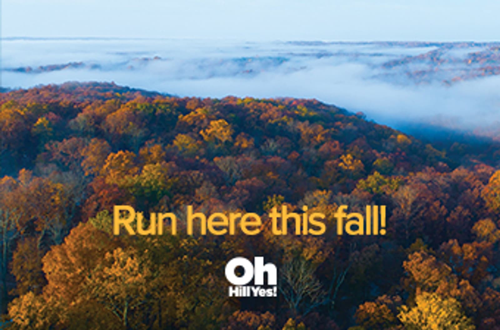 A forest with colorful autumn foliage and misty clouds above. Text reads, "Run here this fall! Oh Hill Yes!.